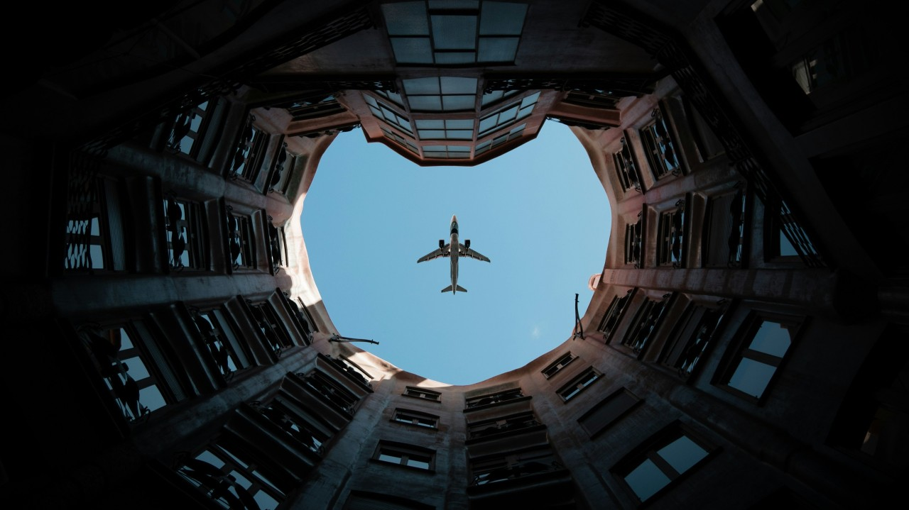 Airplane over courtyard